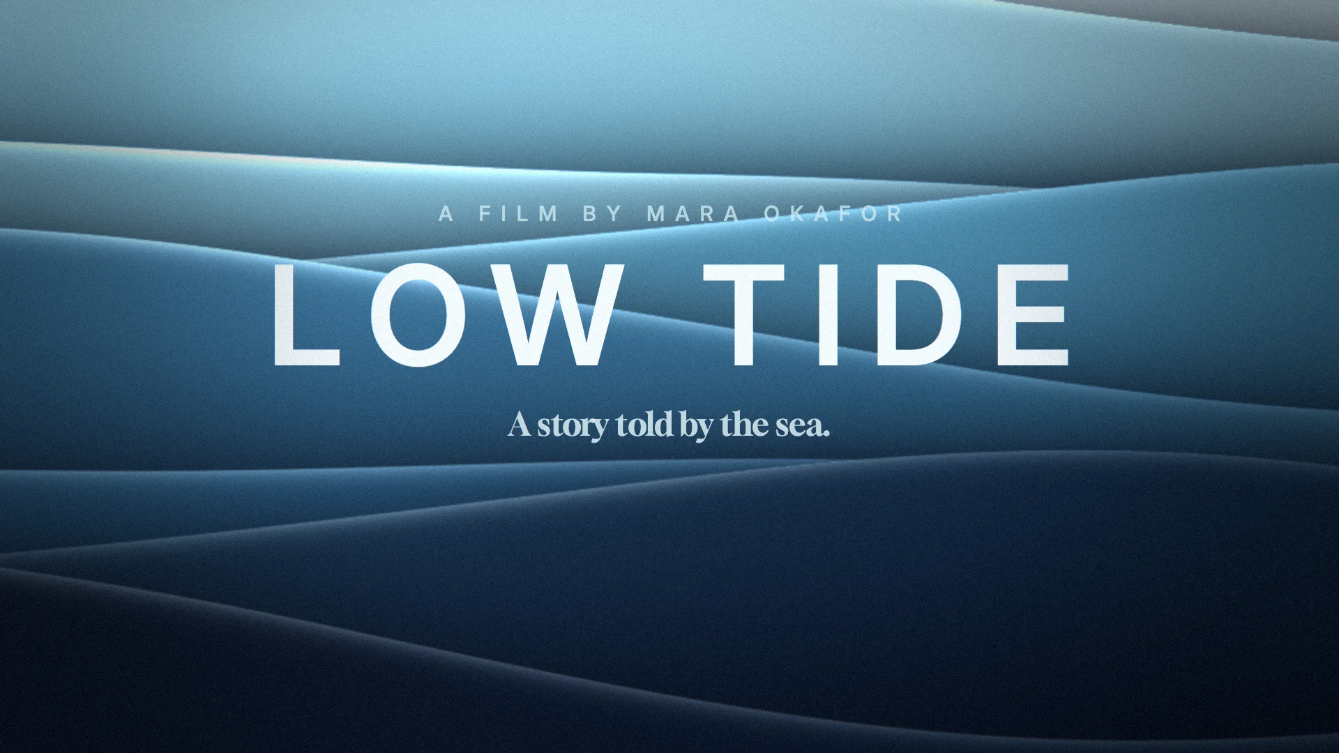 The opening title of a short film, Low Tide: the title in wide white capitals over layered blue swells.